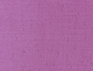 Textured background of violet natural textile   