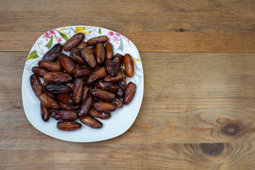 bowl of mixed dry fruits and nuts on wooden table