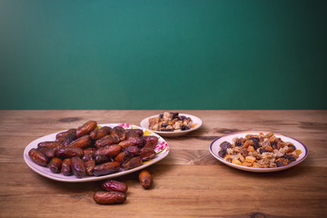 bowl of mixed dry fruits and nuts on wooden table