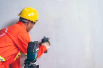 Men and working with laser level machines