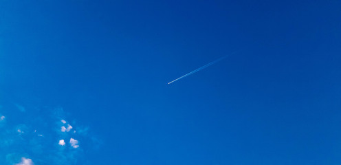 Flight of the aircraft at high altitude in the clouds.