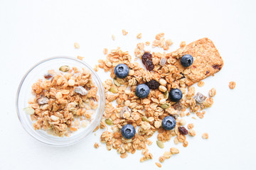 Crunchy muesli and blueberry Breakfast cereals isolated on white background, selective focus, top view