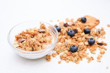 Crunchy muesli and blueberry Breakfast cereals isolated on white background, selective focus, top view