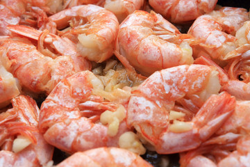 Fried shrimps in garlic sauce close-up