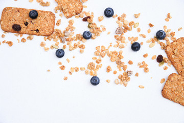 Crunchy muesli cookies and blueberries, Breakfast cereals isolated on white background, selective focus, top view