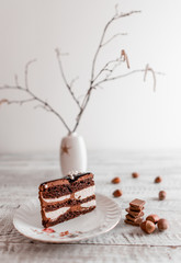  Delicious chocolate cake on plate on table on light wooden background 