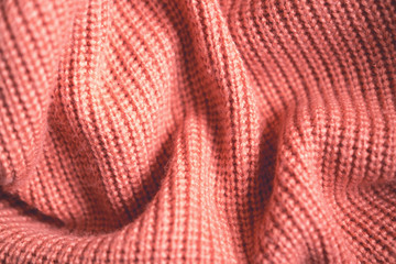 Fototapeta na wymiar Texture of natural knitted fabric. Texture of gray wool fabric with pleats for design
