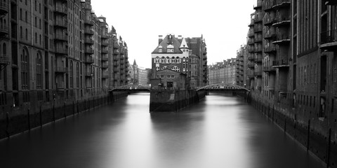 Black and white long exposure of Wasserschloss in the warehouse district of Hamburg