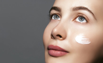 Dermatology, Rejuvenation,moisturizer and skin care. Close up portrait of beautiful model with...