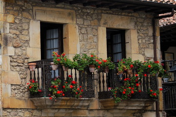 Fototapeta na wymiar Flowers in a balcony of Cantabria, Spain