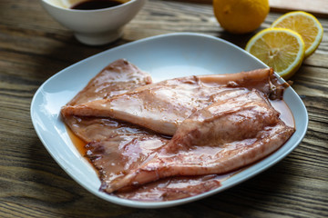 Marinated squid tentacle in a white plate