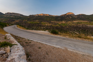 road to small village Trstenik in Peljesac peninsula, with mountins and blue sky as background
