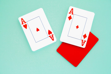 combination of two aces and red cutting card on blue isolated background