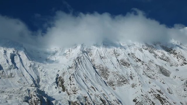 Panoramic shot of Tilicho lake area and high snowy and icy mountains around. Hiking and trekking in Nepal, spring trek around Annapurna mount.