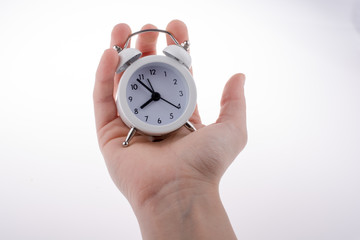 Alarm clock in hand