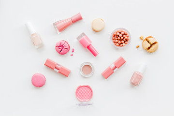 make-up accessories and fashion stylish cosmetics on white desk background top view pattern