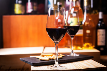 Glass of red wine prepared for tasting in a Europe winery. Copy space
