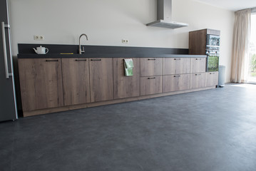 Luxury kitchen with PVC concrete look flooring