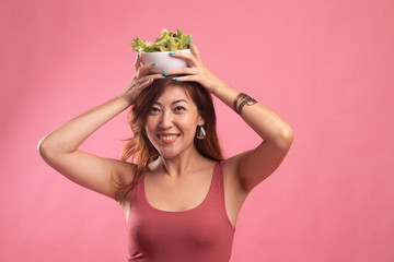 Healthy Asian woman with salad.