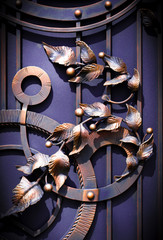 Decoration with forged elements of metal gates, flowers and leaves..