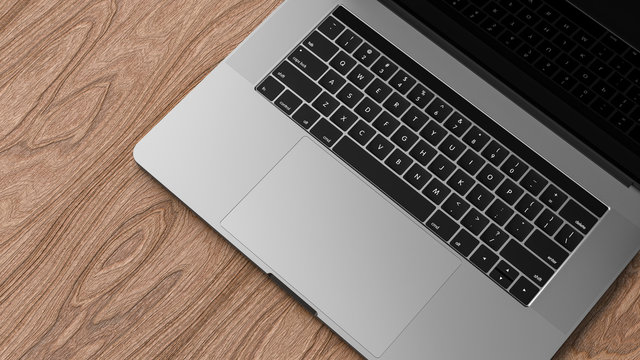 Laptop, dark aluminium body. Laptop in focus. Template, mockup.