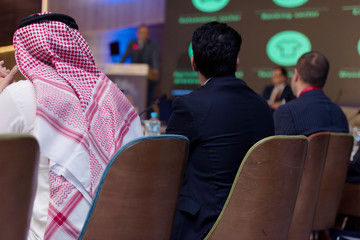 Business Conference and Presentation,Arabic businessman representing model of economic development...