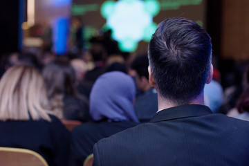 Businessman at business conference room with public giving presentations. Audience at the conference hall. Entrepreneurship club.