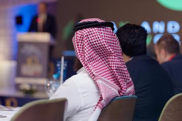 Business Conference and Presentation,Arabic businessman representing model of economic development...