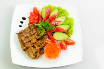 steak meat prepared with fresh vegetables 