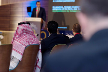 Business Conference and Presentation,Arabic businessman representing model of economic development...