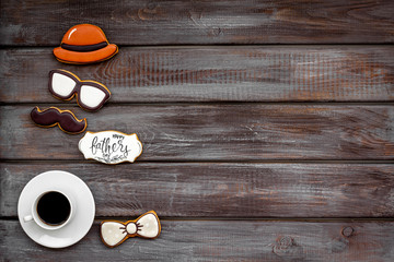 moustache, hat, glasses, coffee, gift and copy for Happy Father Day party on wooden background top view copy space