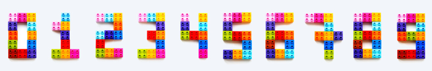 Set of numbers from 0 to 9 made of colorful constructor blocks. Toy bricks lying in order from zero...