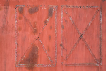 The aged tape marks on a steel door