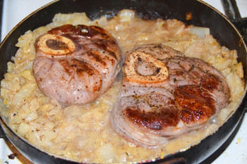 Ossobuko grilled beef with cabbage in a pan cooking dish