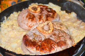 Ossobuko grilled beef with cabbage in a pan cooking dish