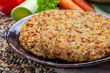 Tasty vegetarian food, raw burgers made from lentils legumes with vegetables ready for cooking
