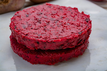 Healthy vegetarian food, raw round burgers made from red beetroot
