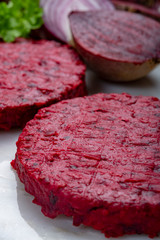 Healthy vegetarian food, raw round burgers made from red beetroot