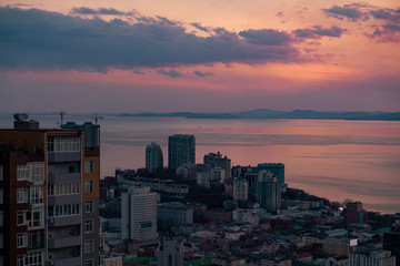 Panoramic view of the city of Vladivostok against the sunset.