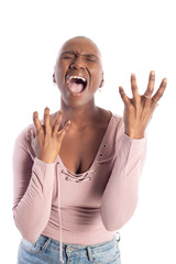 Black african american female model with bald hairstyle wearing a pink shirt on a white background looking angry and furious