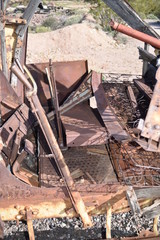 Abandoned, rusted-out vintage automobiles and trucks.