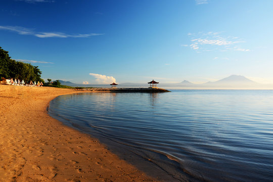 Pantai Karang, Sanur Beach, Bali, Indonesia, Asia with the Mount Agong volcano background during sunrise. Pantai Karang is a small section of Sanur Beach&rsquo;s entire coastal length.
