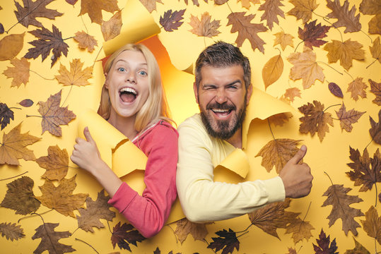 Joyful couple is happy with the last warm days of autumn. Happy couple in love wearing in autumn clothes on sunny day. Funny couple are getting ready for autumn sale. Autumn concept. - Powered by Adobe