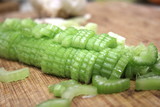 Macro sliced celery, sliced celery on chopping board