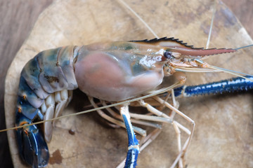 Shrimp on Chopping Wood and wood background