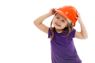 Little girl in the construction helmet.