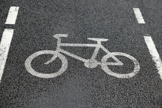 Bike lane. Road sign Bicycle on road. Bike path. Print on surface bitumen