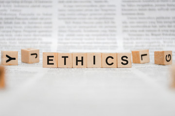 Ethics Word Written In Wooden Cube - Newspaper