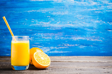 Fresh squeezed orange juice on the rustic background. Selective focus. Shallow depth of field. 