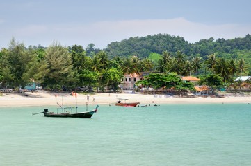 Fototapeta na wymiar Tropical turquoise sea bay, paradise sandy beach, palm trees, tourist resorts, Haad Kwang Pao Beach in Khanom district of Nakhon Si Thammarat province of Thailand.